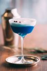 Blue cocktail on a wooden table — Stock Photo
