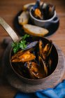 Delectable mussels with herbs in metal saucepan — Stock Photo