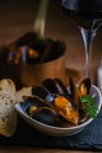 Delectable mussels with herbs in bowl — Stock Photo