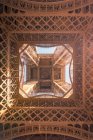 From below of observation tower with support posts and symmetrical decor on sunny day in Paris France — Stock Photo