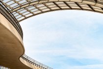 Low angle of curvy fenced road signs on posts on overpass — Stock Photo