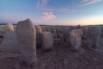 Dolmen of Guadalperal with ancient megalithic monuments on dry land under glowing sun in twilight in Caceres Spain — Stock Photo