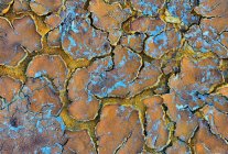Abstract texture of cracked mud with wonderful colors and formations — Stock Photo