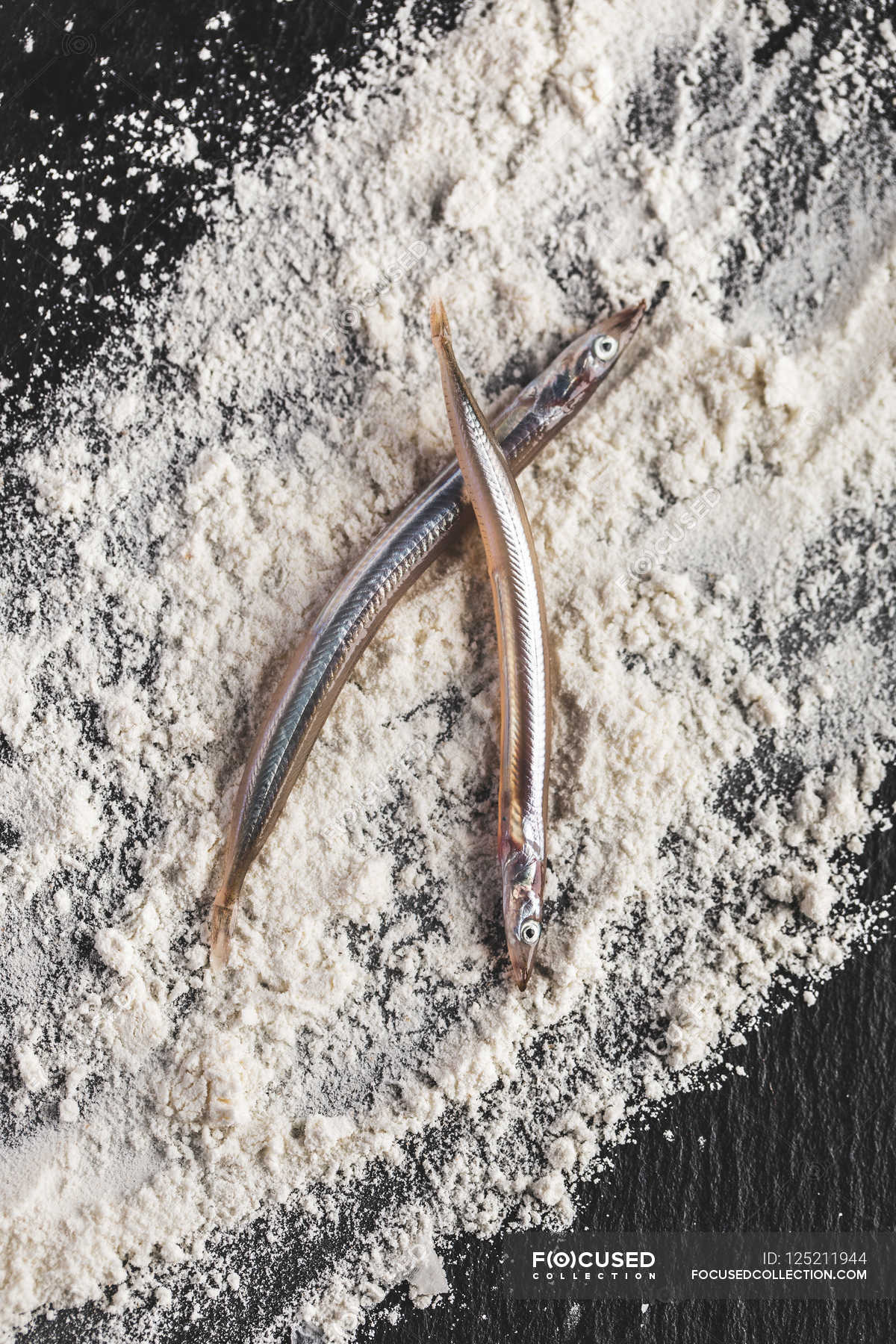 Delicious Sand Eels — uncooked, healthy Stock Photo 125211944