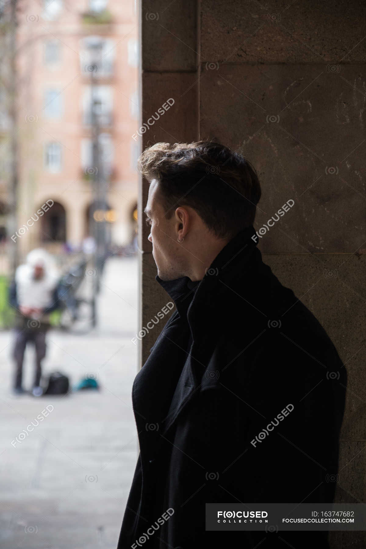 Man wearing black outfit and turning away — anonymous, hiding - Stock ...