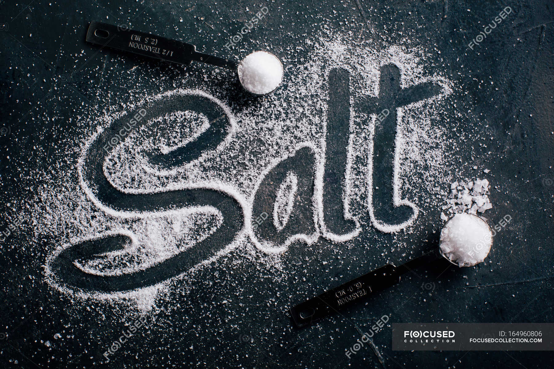 salt-and-the-word-salt-coffespoon-board-stock-photo-164960806