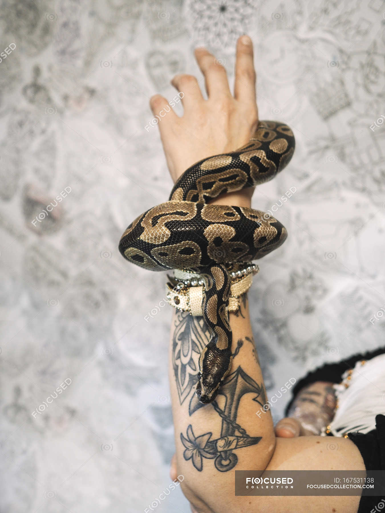 Green Ink Snake Tattoo On Left Wrist