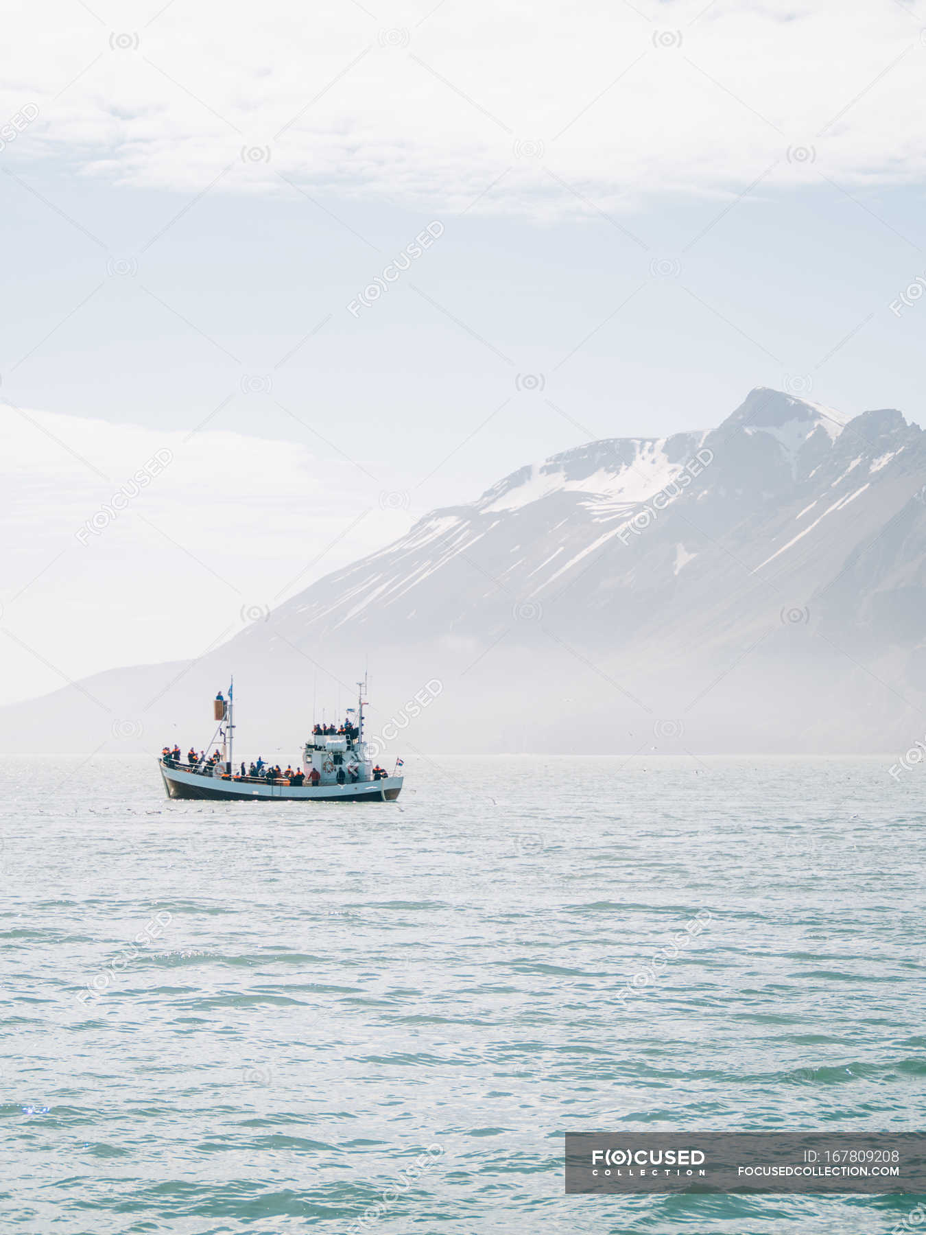 Boat in sea over mountain — background, outdoor Stock Photo 167809208