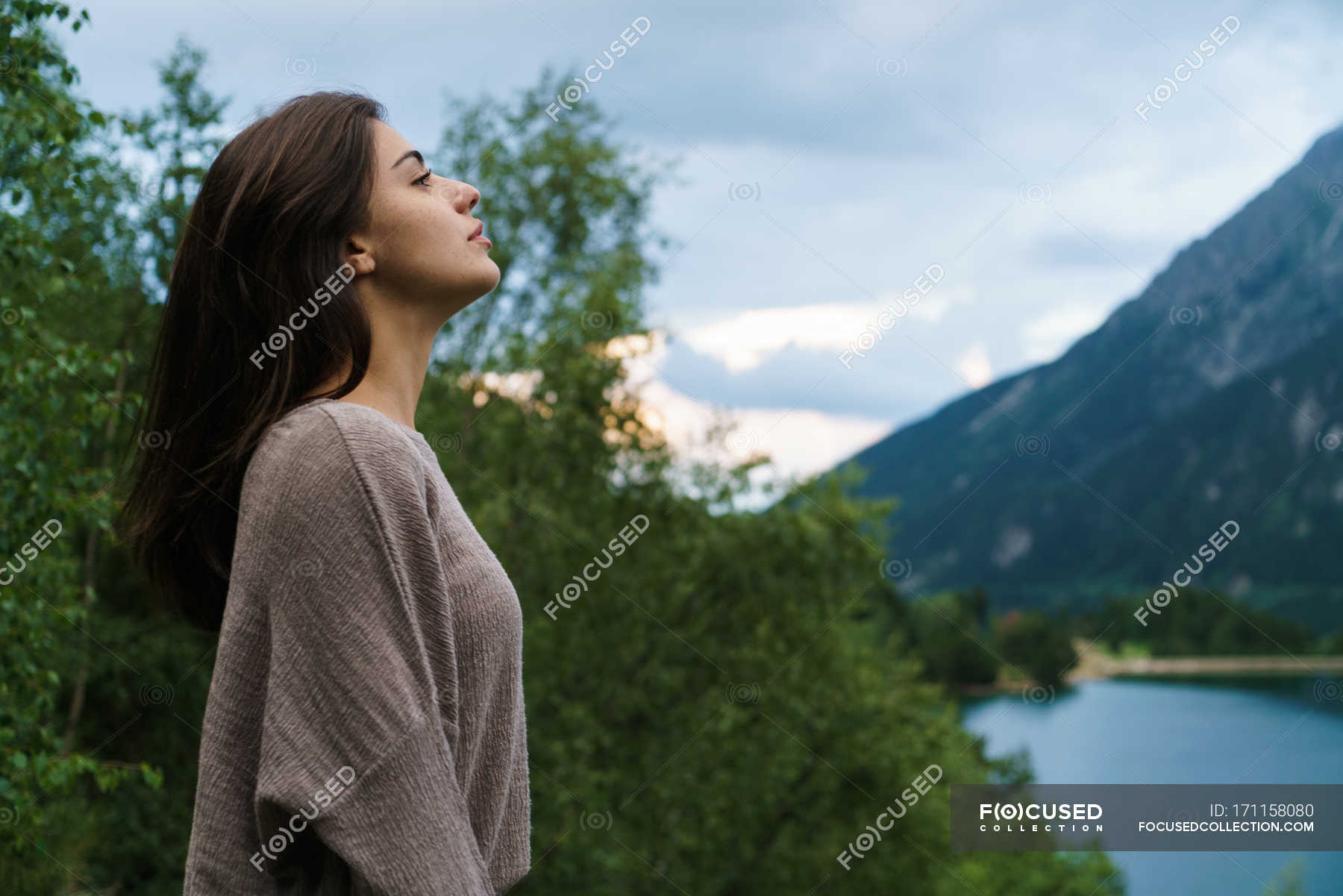 Brunette girl posing over mountain lake — hiking, water - Stock Photo ...