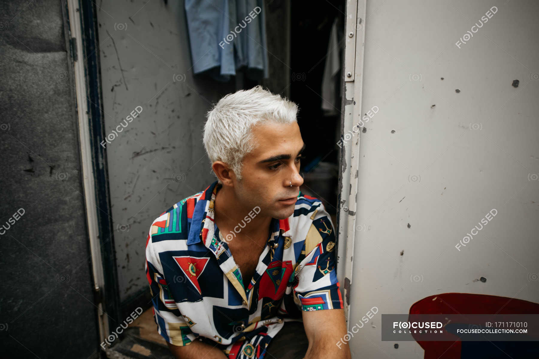 Man with bleached hair looking away — shirt, people - Stock Photo |  #171171010