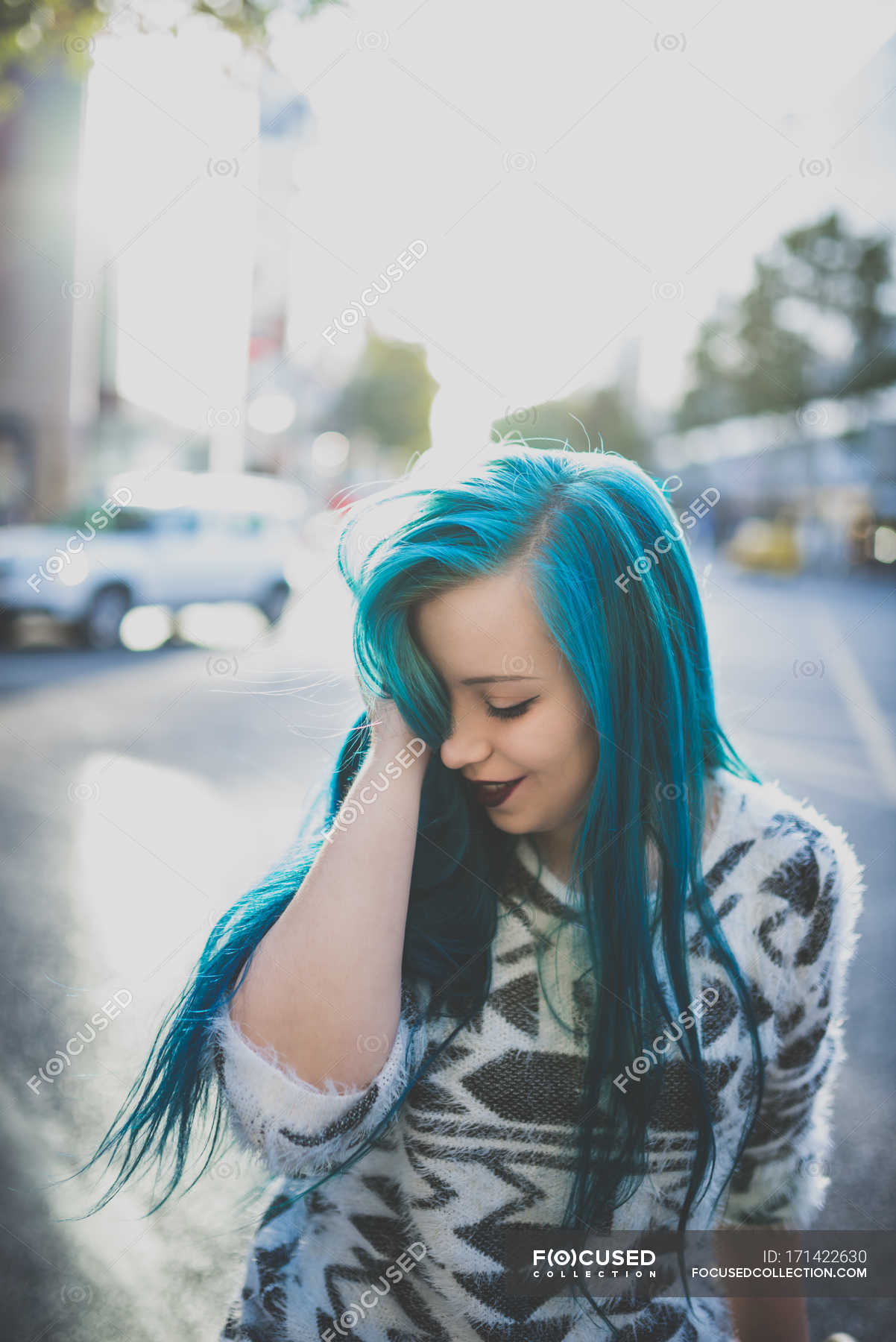 Portrait Of Young Girl Wearing Soft Sweater Smoothing Her Blue