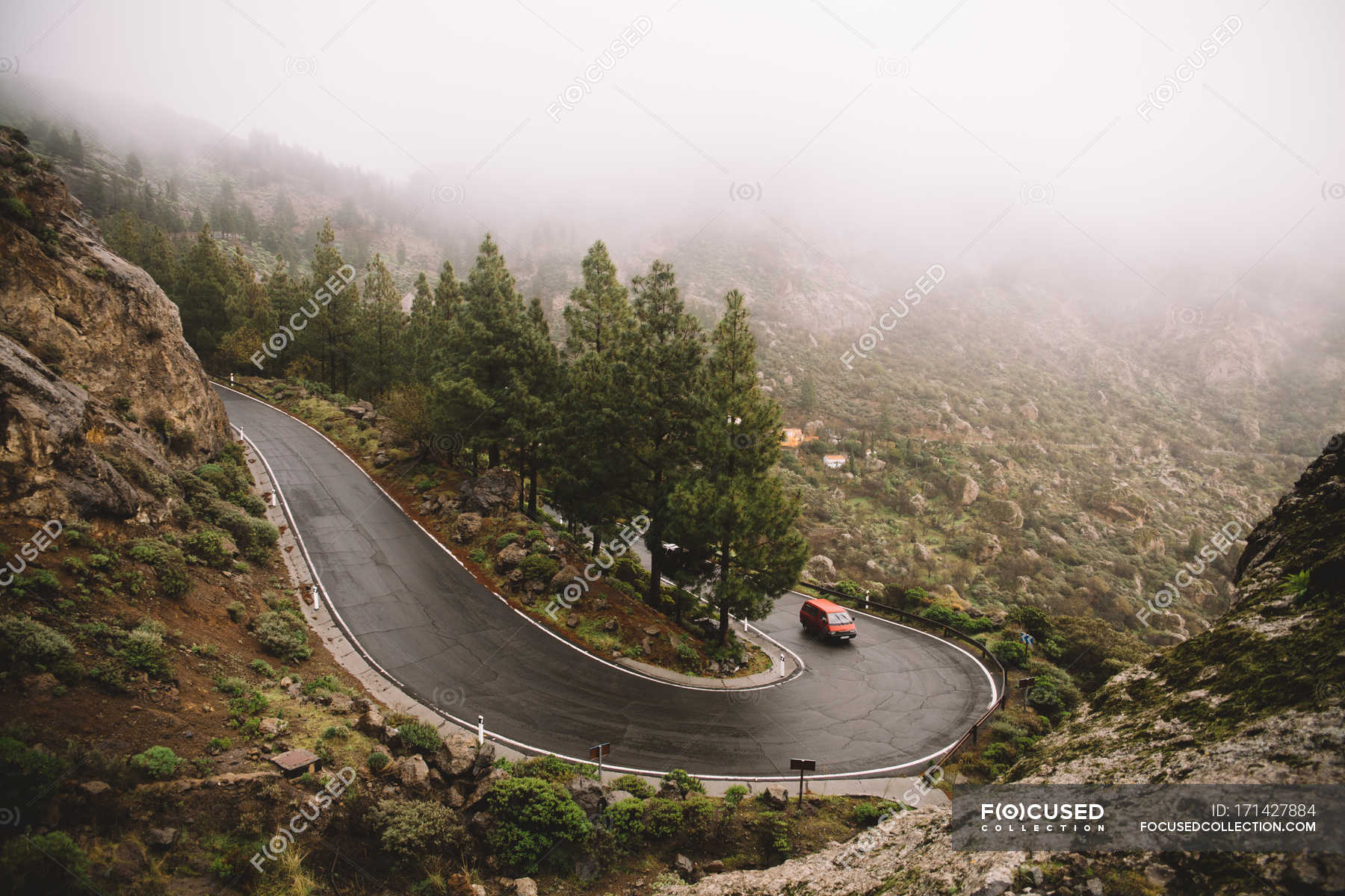 Car Driving Down Winding Road