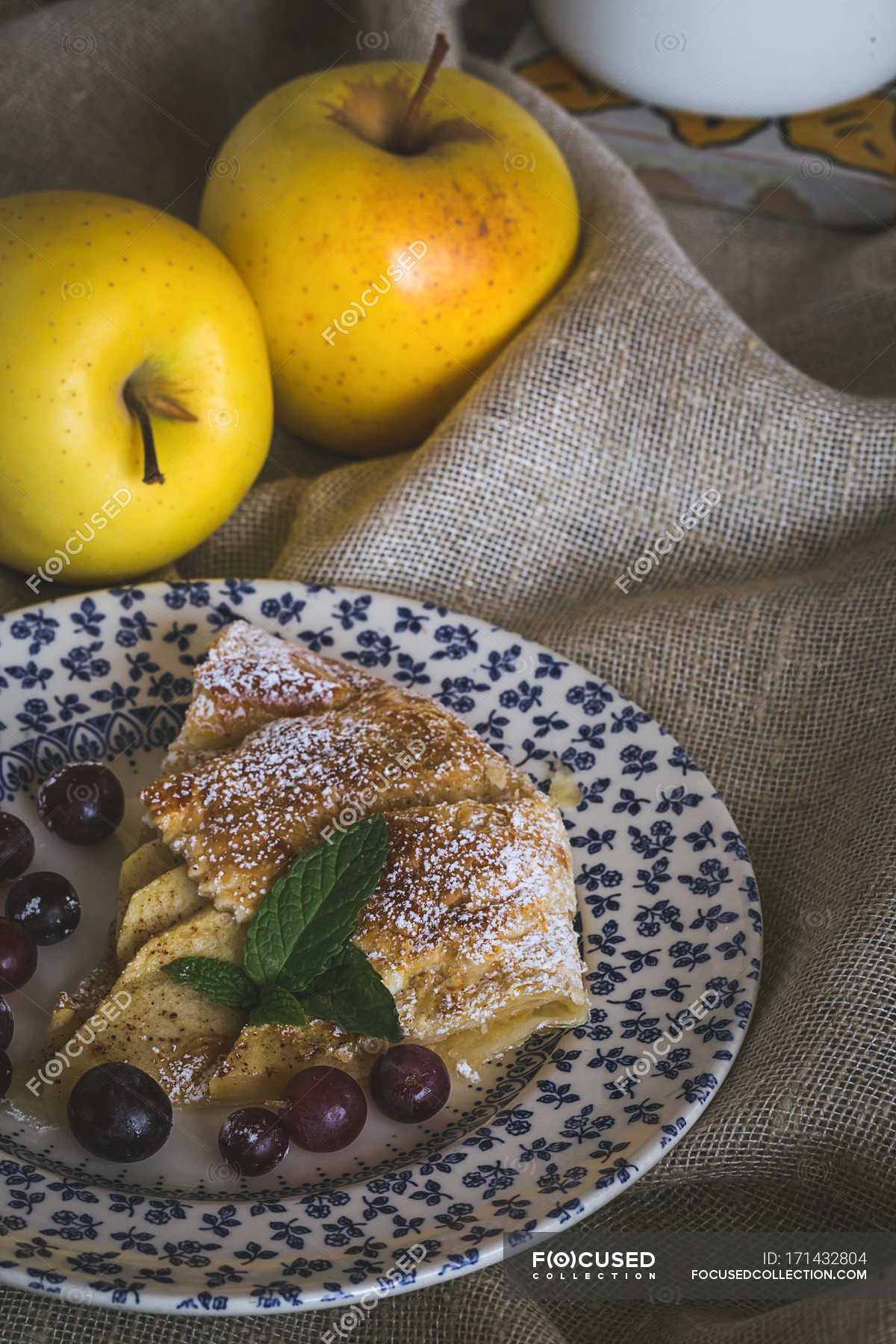 plate-with-apple-pie-piece-cinnamon-sack-cloth-stock-photo