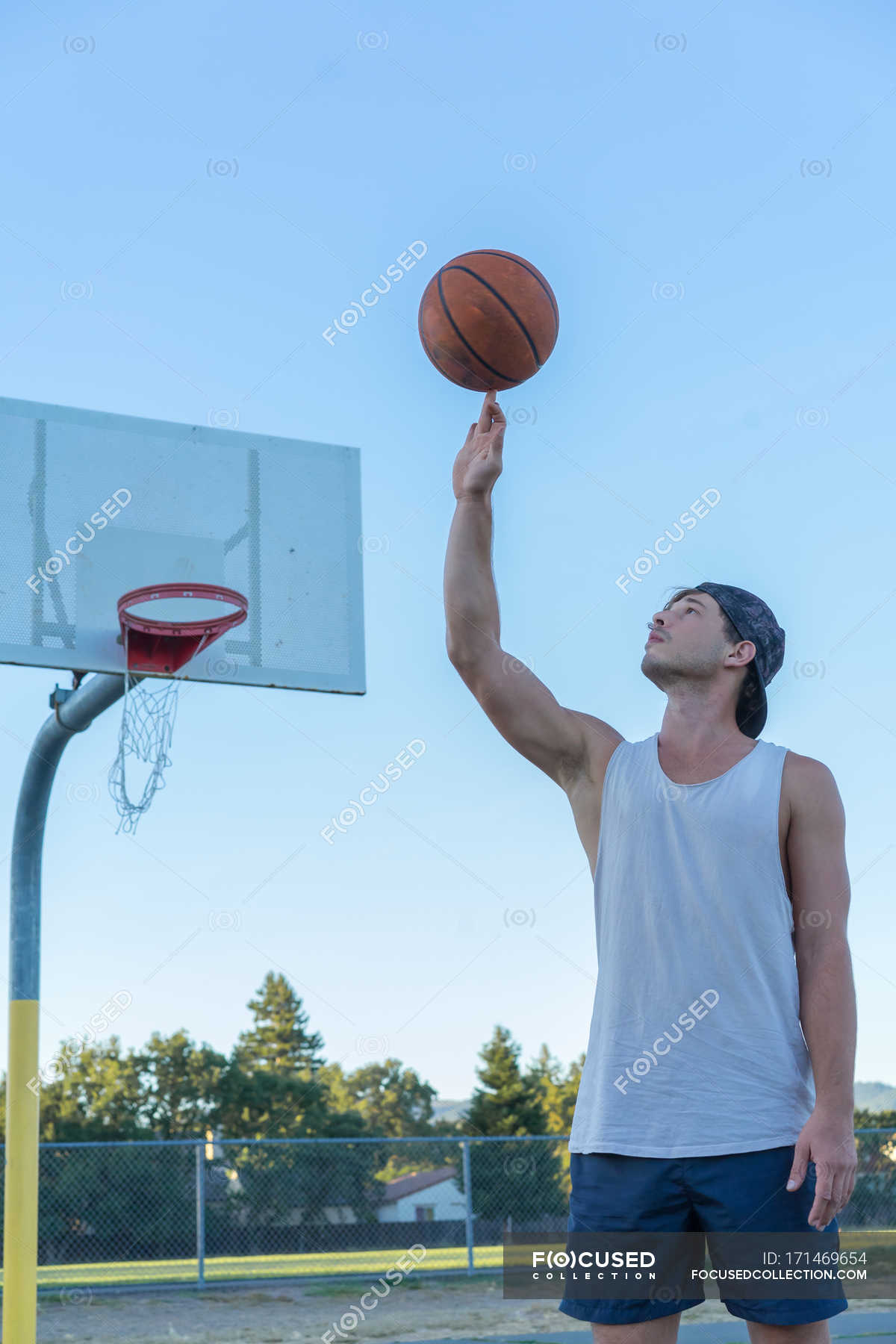 Man Spinning Basketball — Vertical, Sport - Stock Photo 