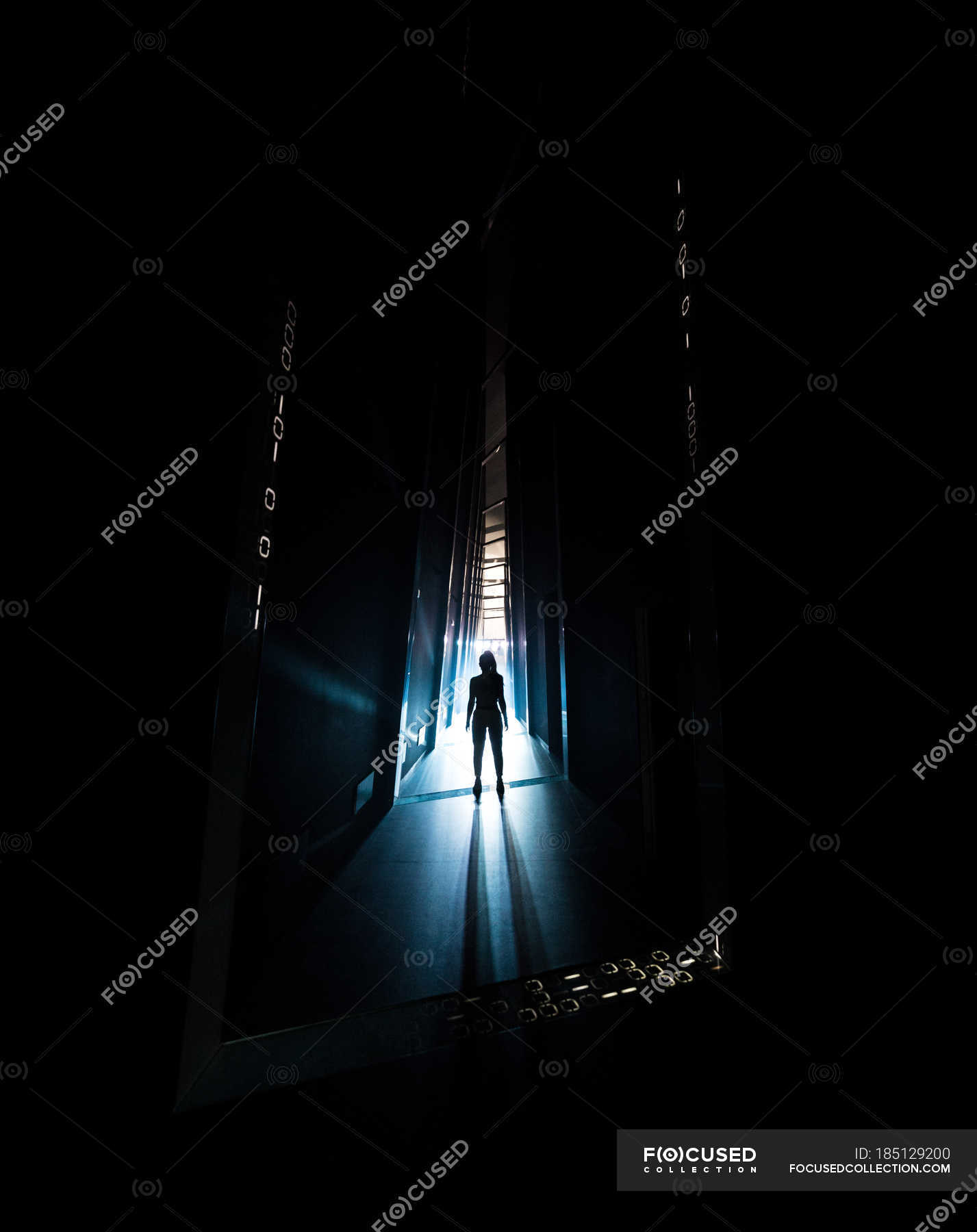 Creepy silhouette of person standing in dark hallway. ??? human, concept