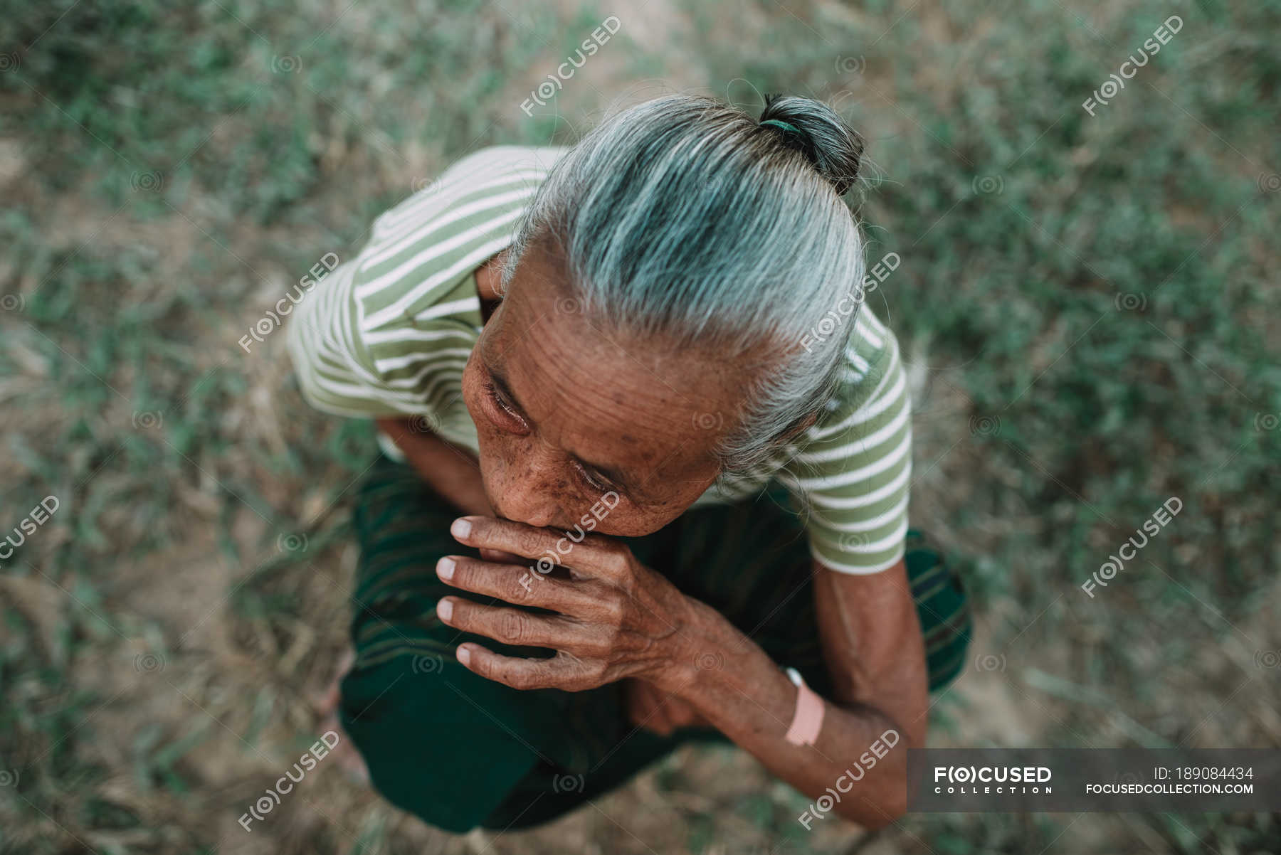 Nong Khiaw Laos From Above Shot Of Mature Local Woman Sitting On Ground Nature Lifestyle