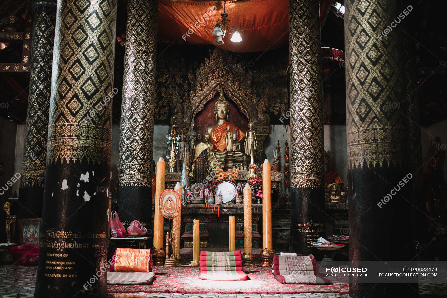 Bronze Buddha statue at altar in temple — symbol, asian Stock Photo