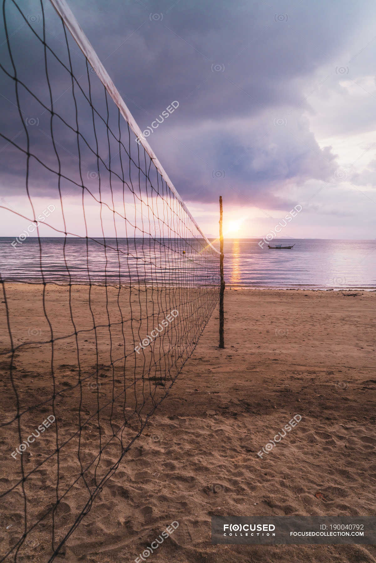 beach volleyball net sunset