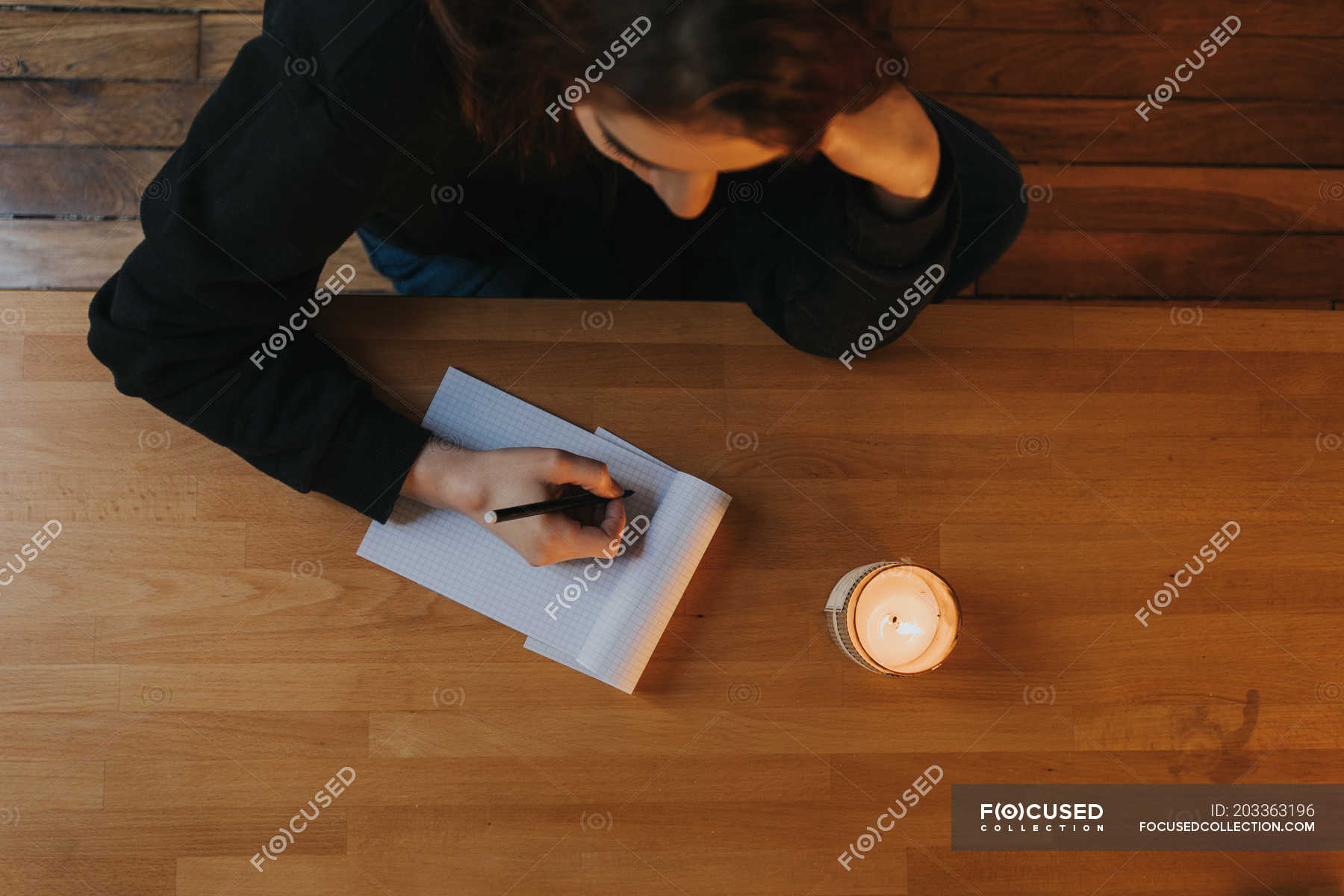 Woman writing in notepad — from above, young woman - Stock Photo ...
