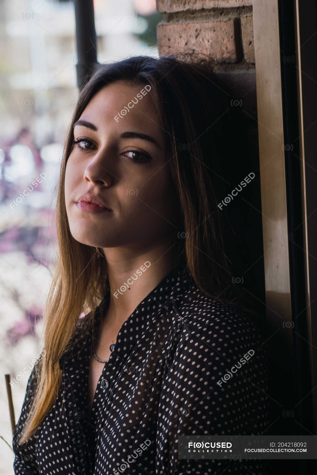 Portrait of Dreamy young woman standing on balcony — female, casual ...