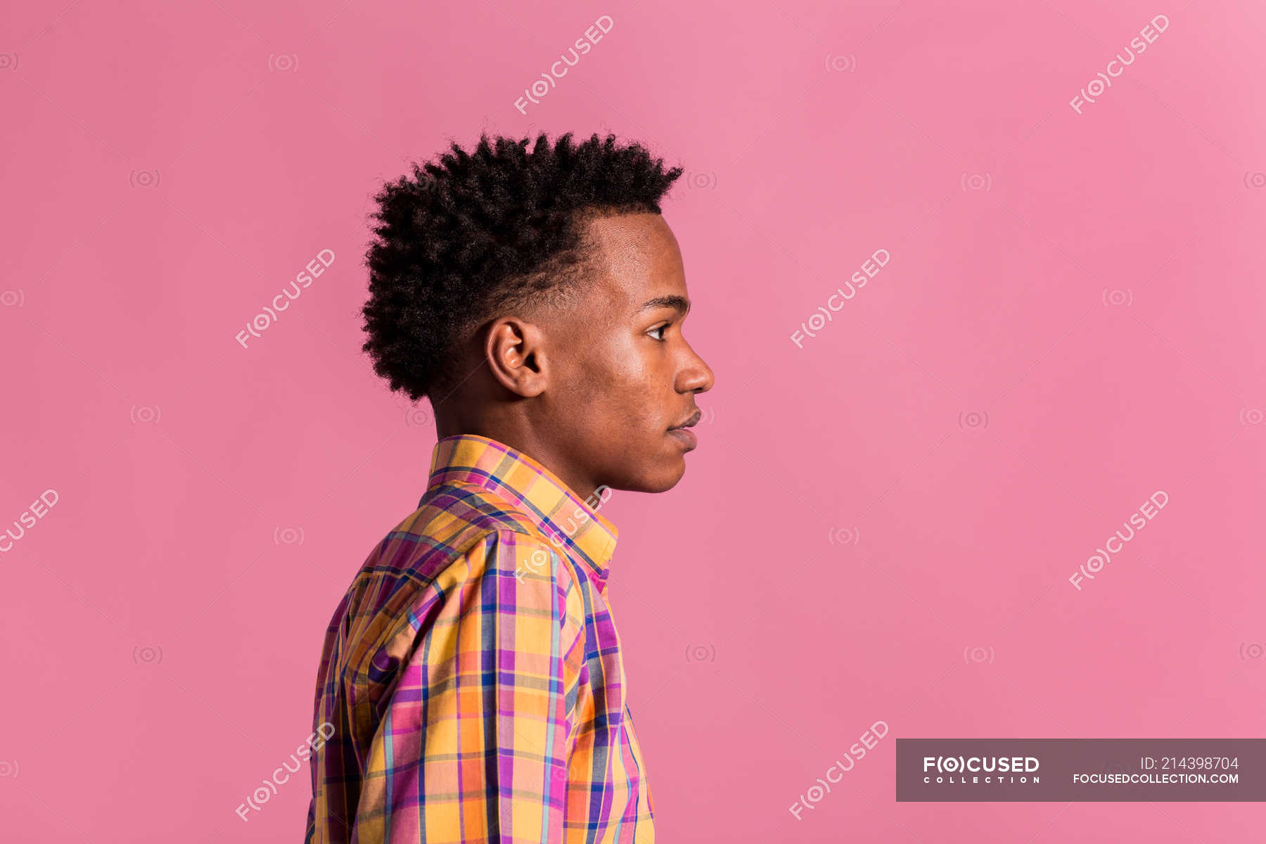 Hipster Black Man In Colorful Shirt Standing On Pink Background