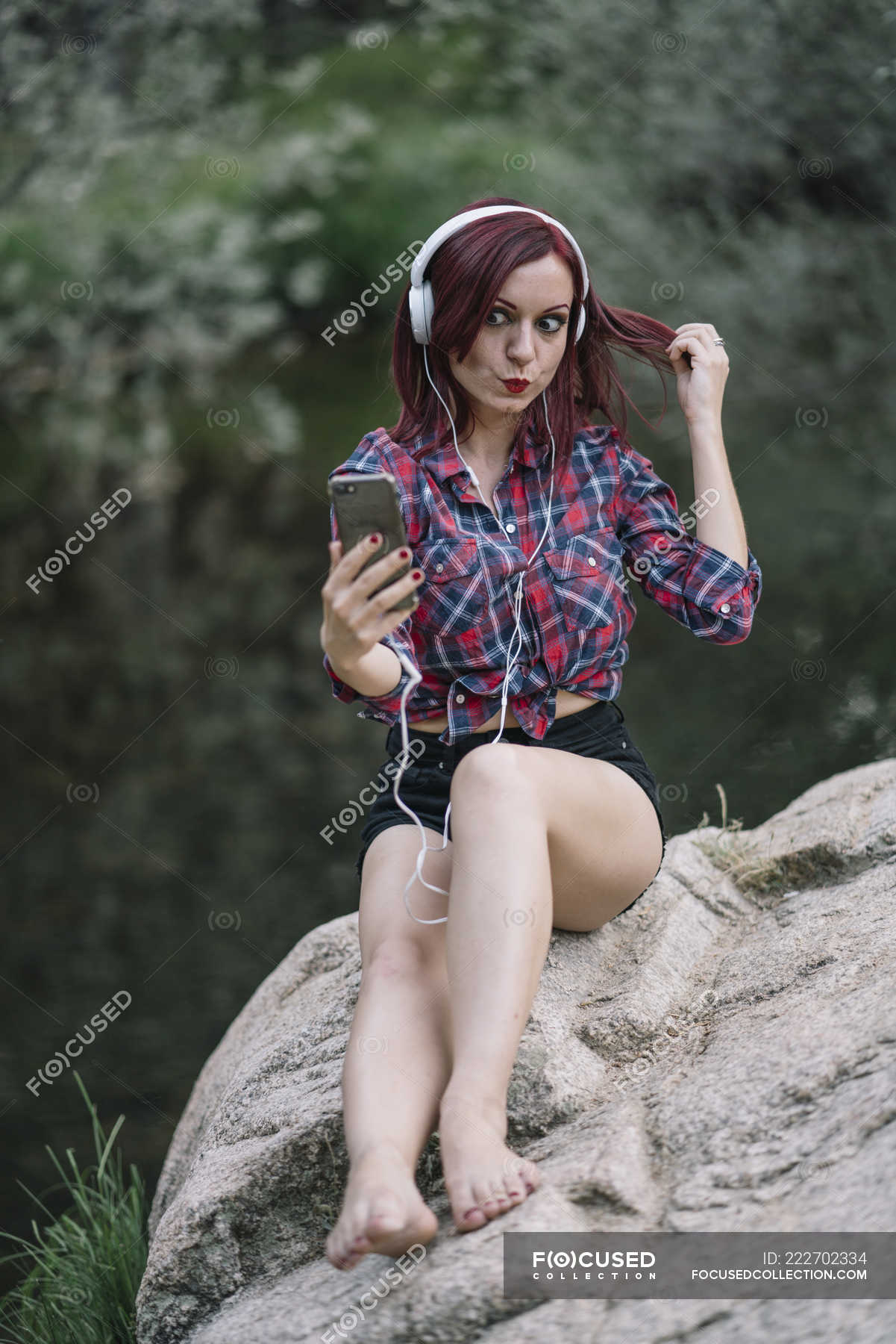 https://st.focusedcollection.com/9163412/i/1800/focused_222702334-stock-photo-red-haired-girl-listens-music.jpg