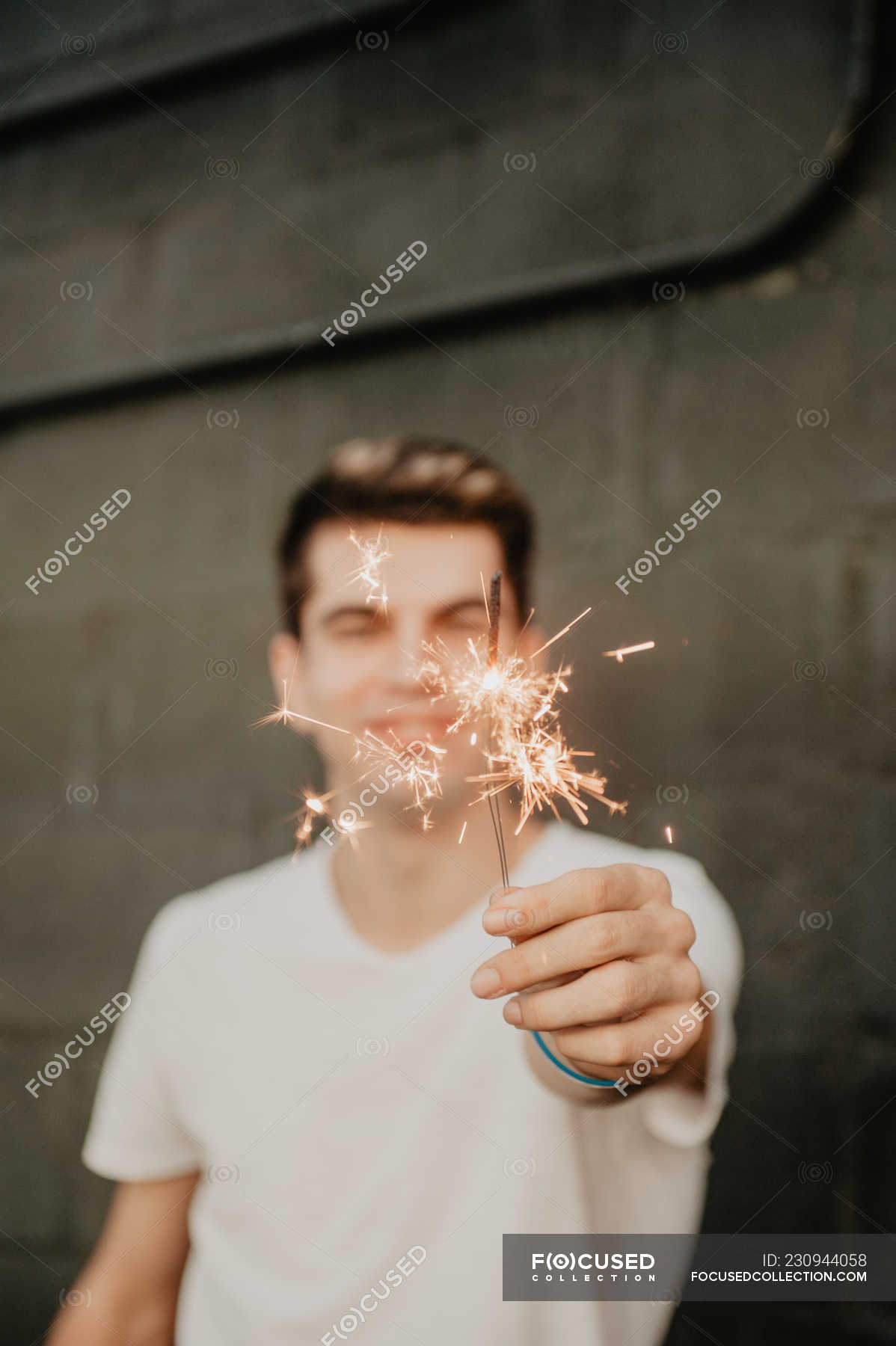 Young Handsome Man In White T Shirt Standing Inside Building And
