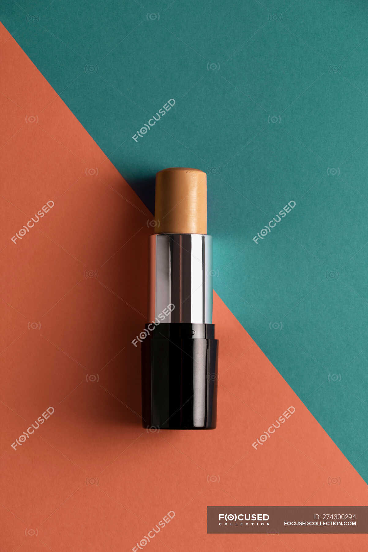 Concealer stick on modern background with geometric shapes. — bar