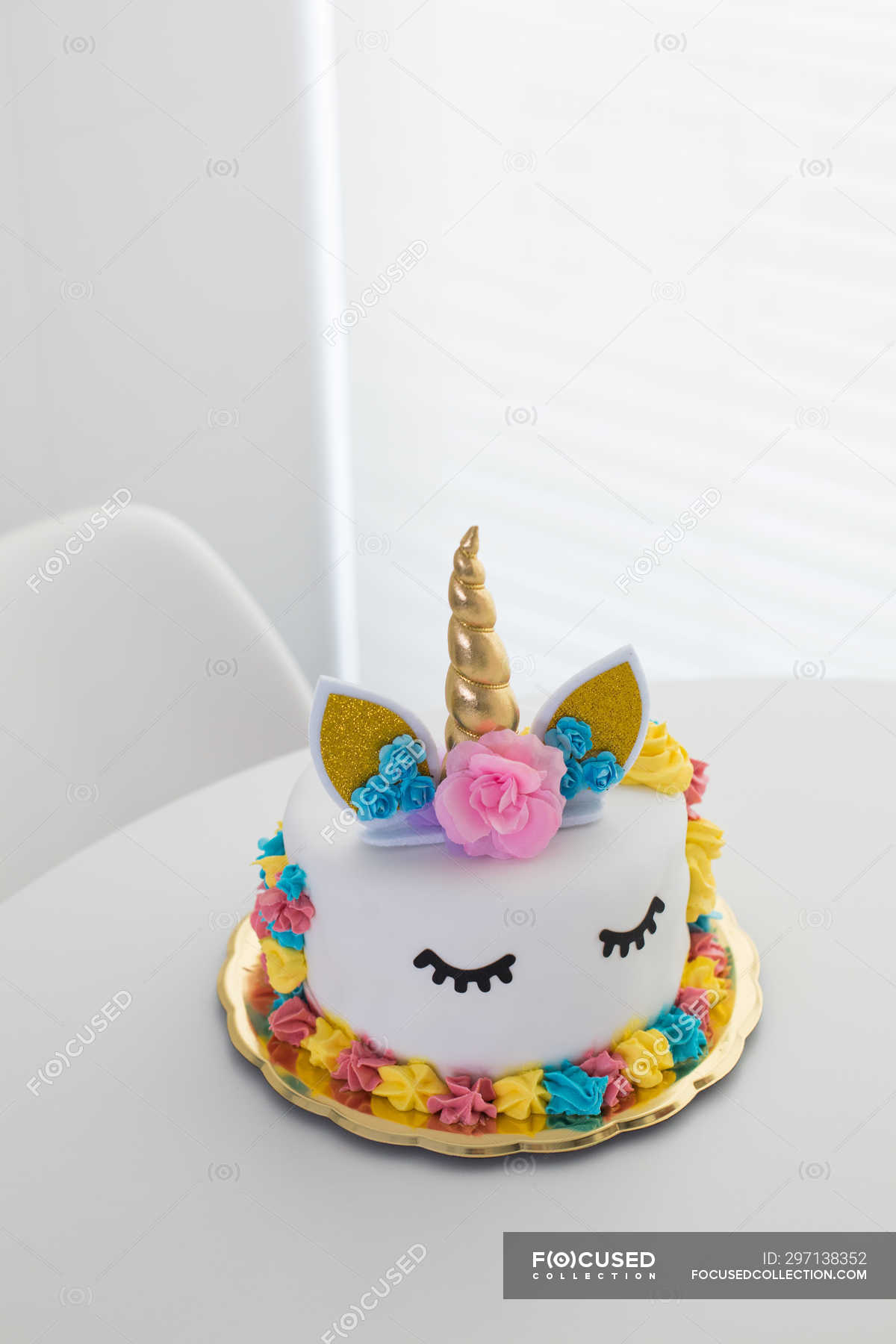 Cute unicorn cake with painted closed eyes Stock Photo - Alamy