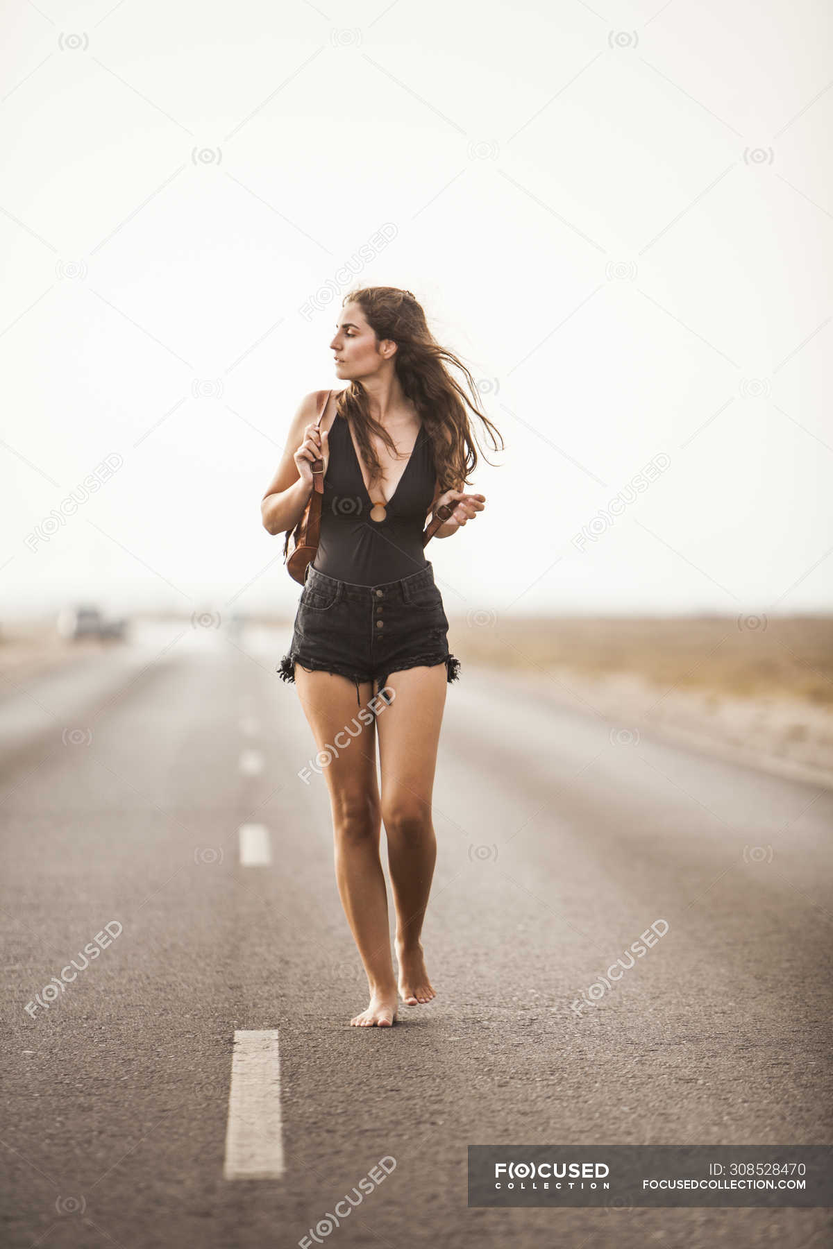 Focused 308528470 Stock Photo Attractive Young Barefoot Woman Walking 