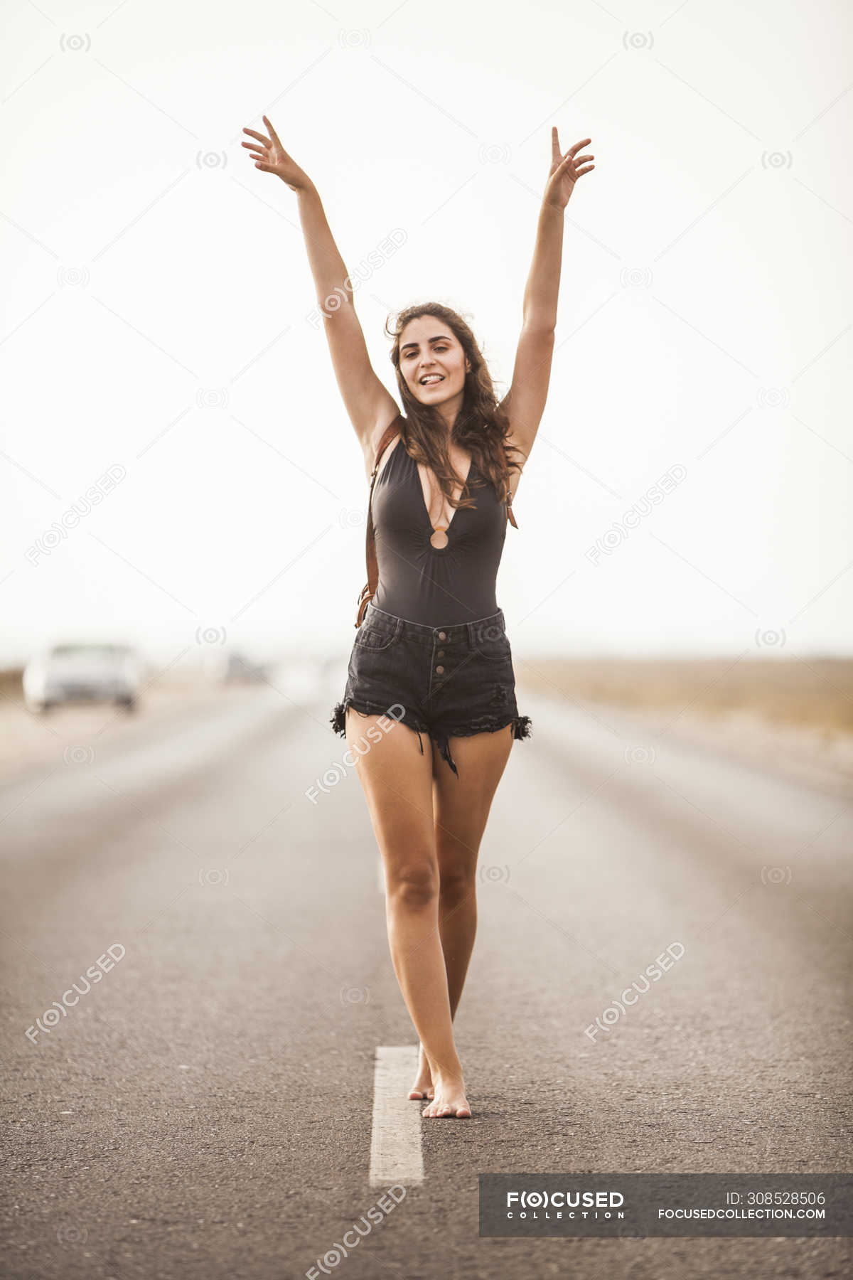 https://st.focusedcollection.com/9163412/i/1800/focused_308528506-stock-photo-attractive-young-barefoot-woman-smiling.jpg