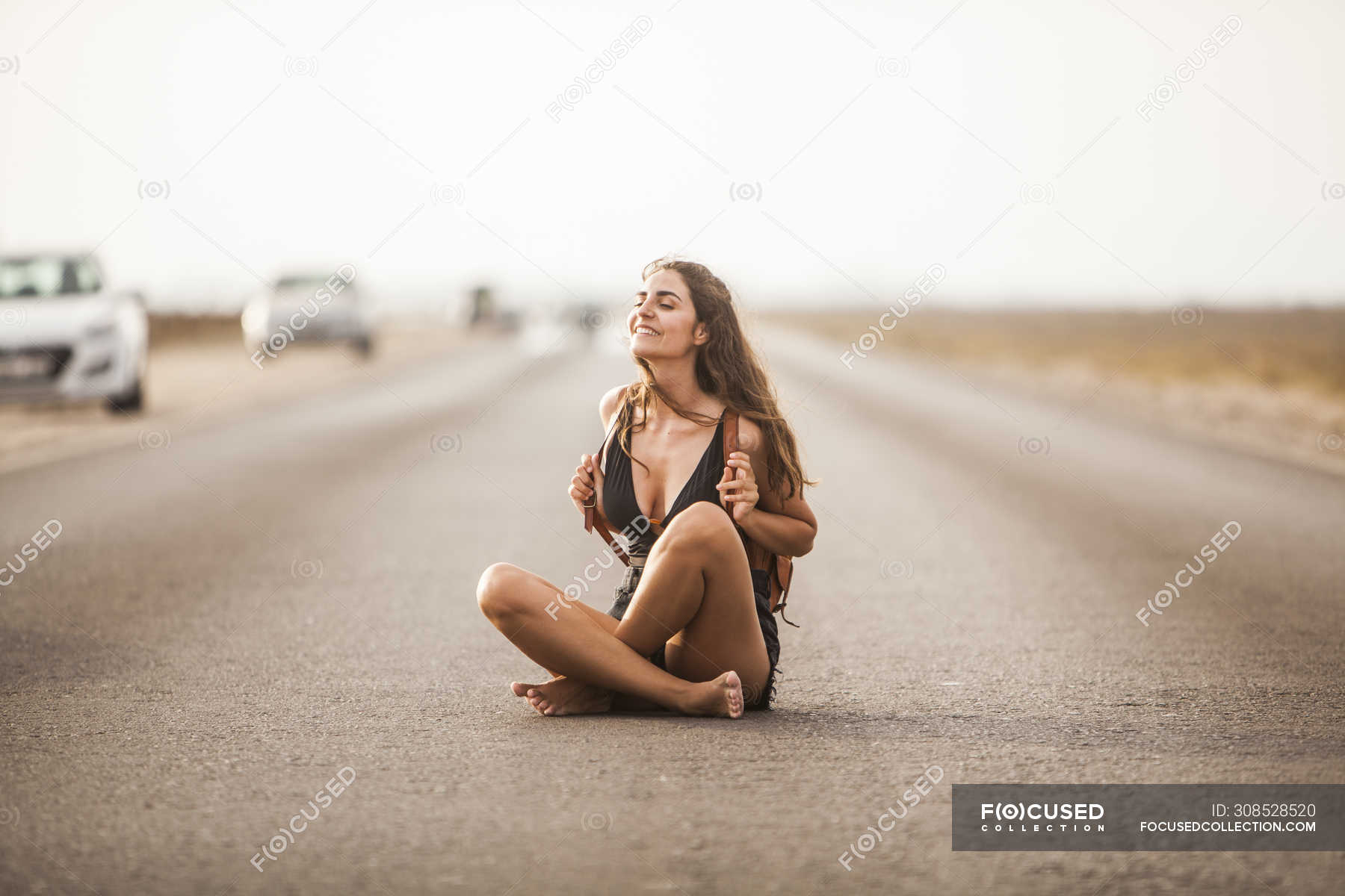 https://st.focusedcollection.com/9163412/i/1800/focused_308528520-stock-photo-attractive-young-woman-smiling-sitting.jpg