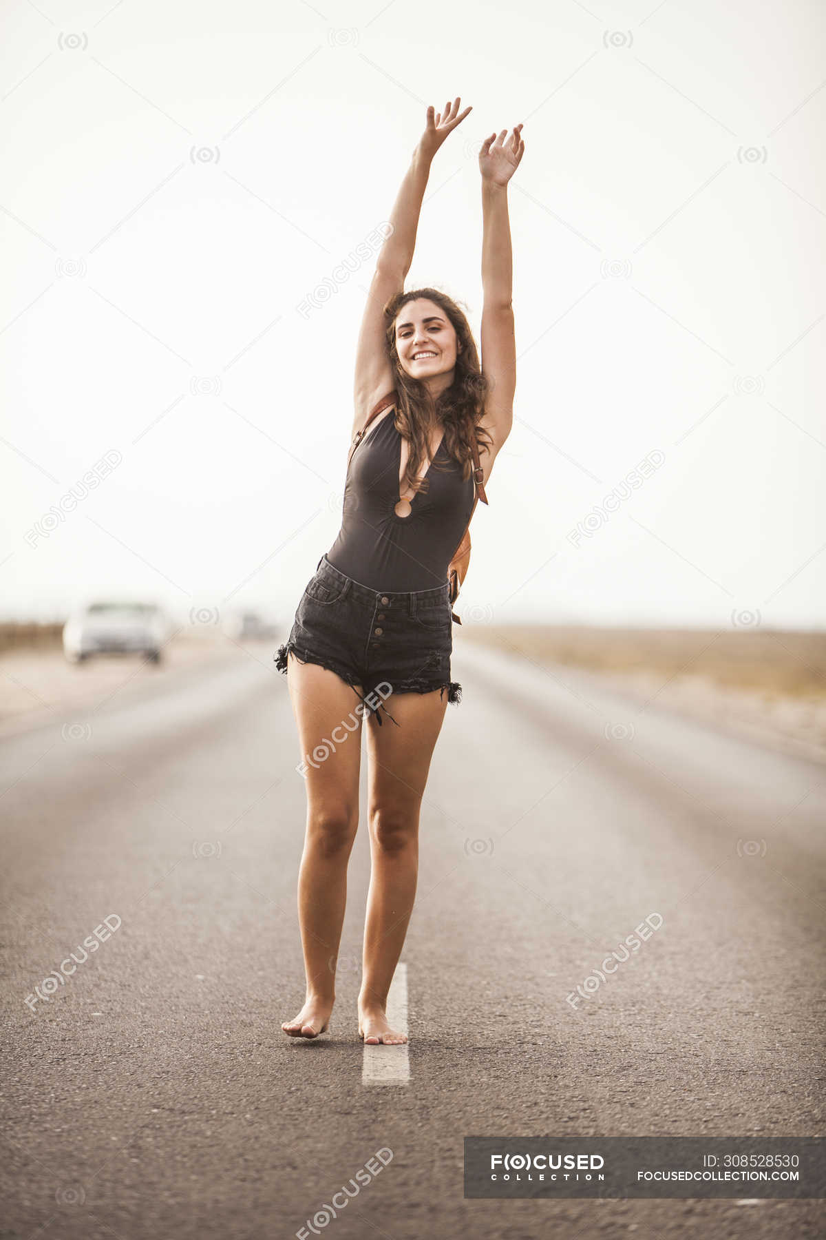 https://st.focusedcollection.com/9163412/i/1800/focused_308528530-stock-photo-attractive-young-barefoot-woman-smiling.jpg