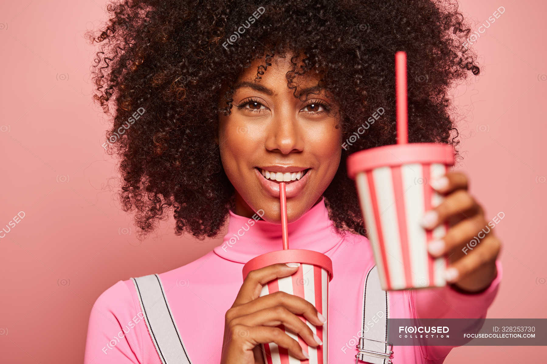 Happy Black Woman With Disposable Cup Of Drink Standing Against Pink Background — Beverage 