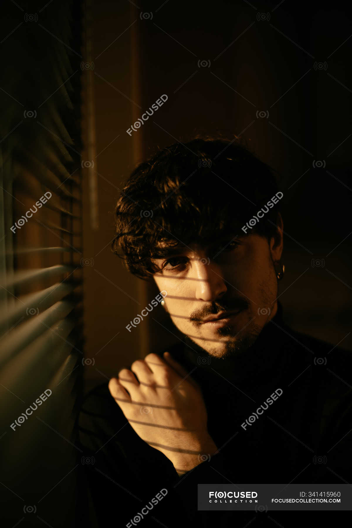 Young Melancholic Guy In Black Turtleneck Standing Next To Window With ...