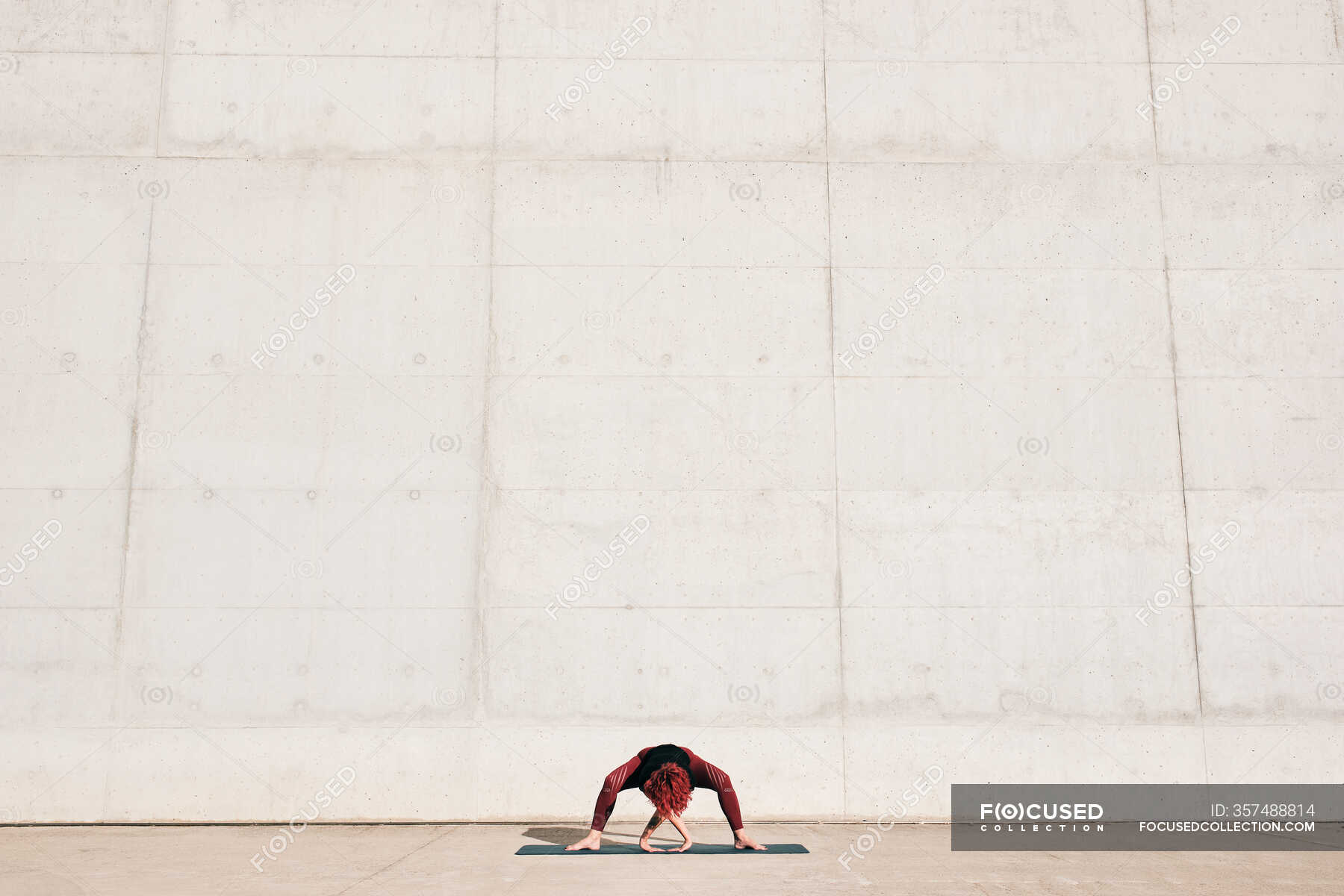 Unrecognizable Fit Female Athlete In Sportswear Doing Wide Legged