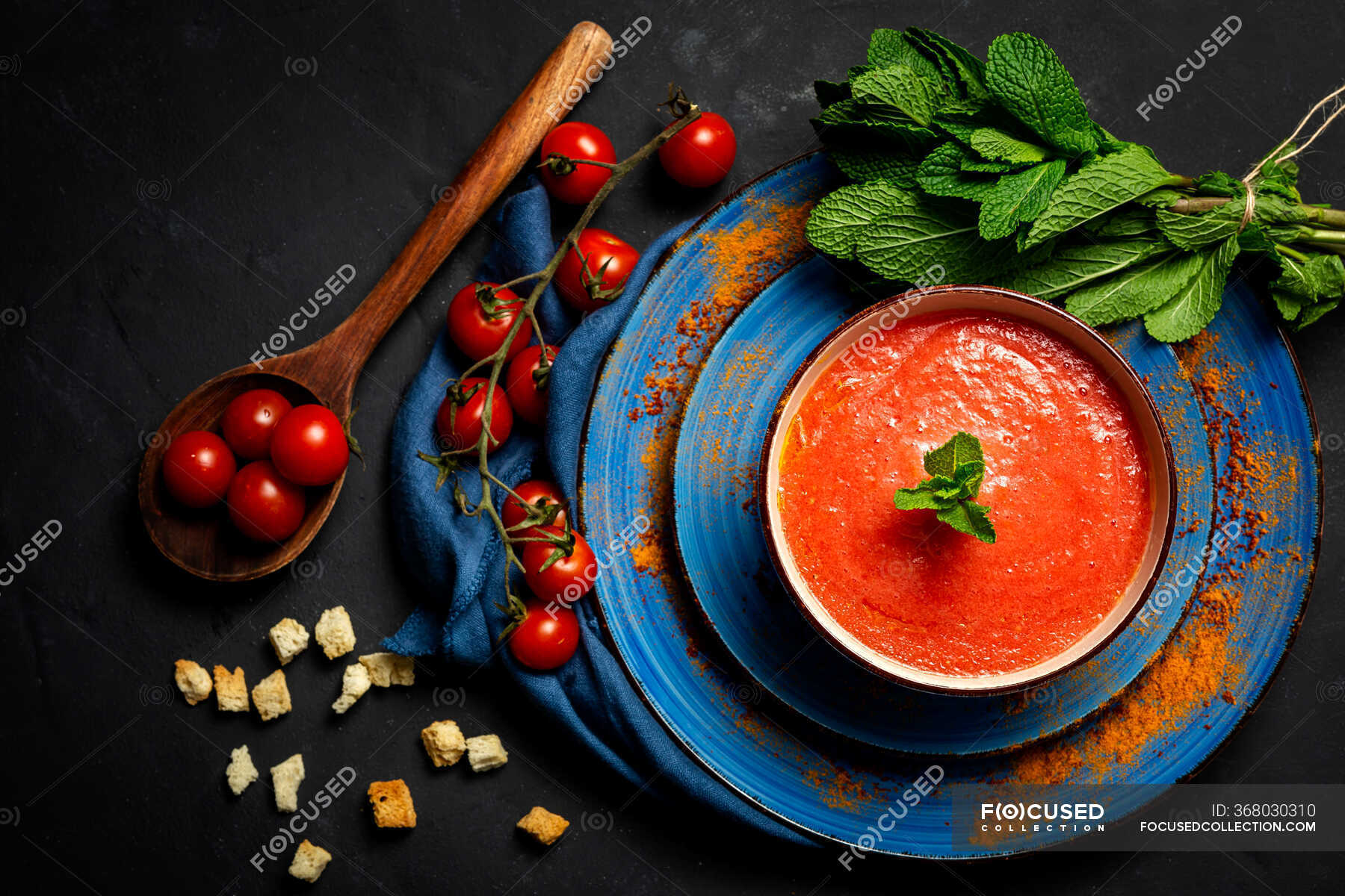Healthy Homemade Tomato Soup with Bread, Mint and Olive Oil on Dark