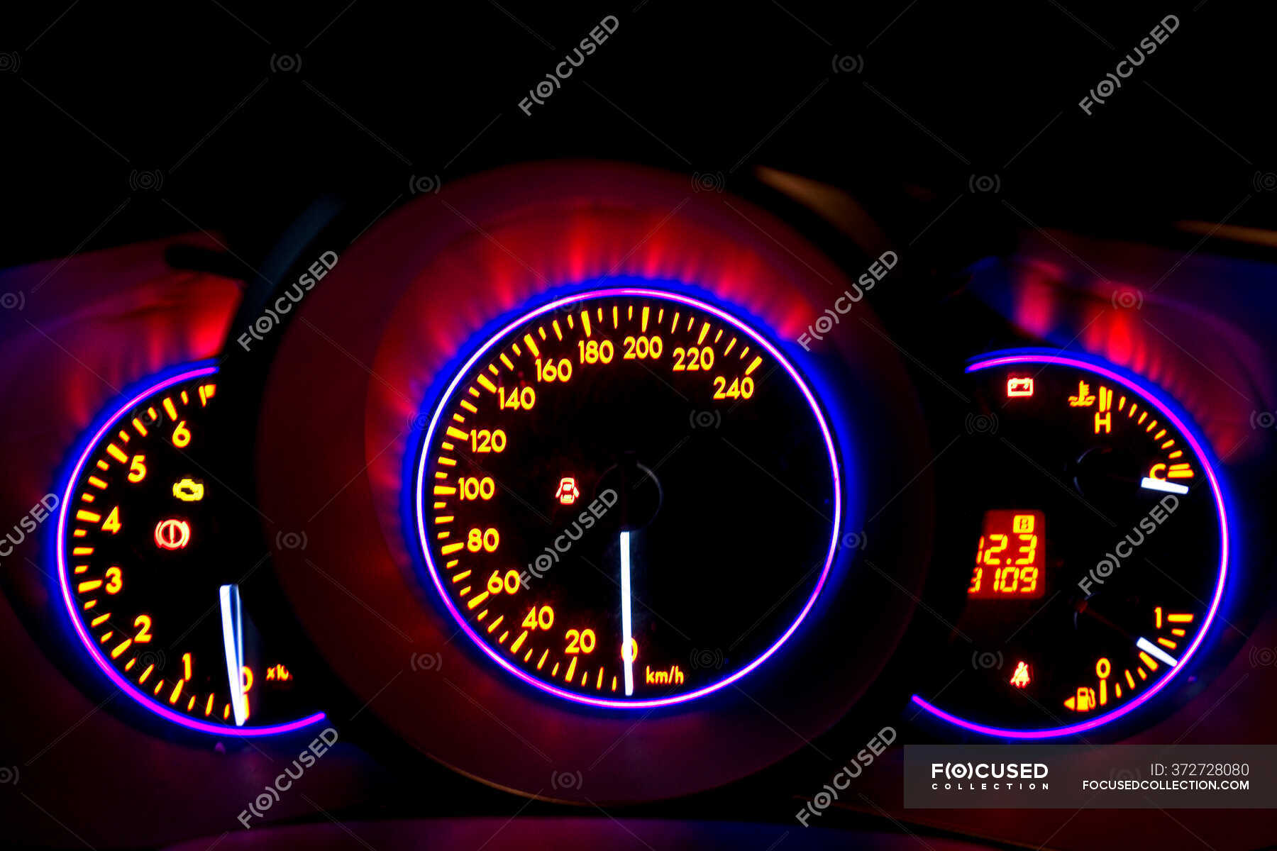 Car instrument panel with neon illumination on digital display with