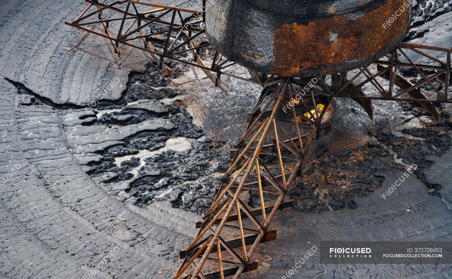 From above of old broken steel construction with blades and rotating ...