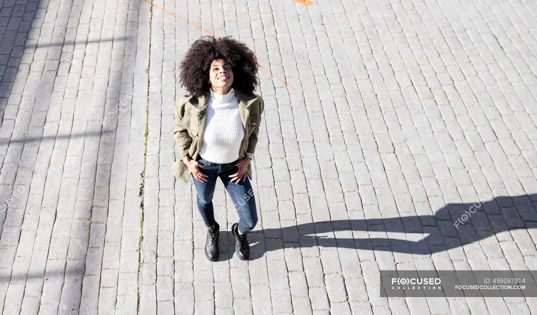 From above of expressive young black lady with Afro hairstyle in ...