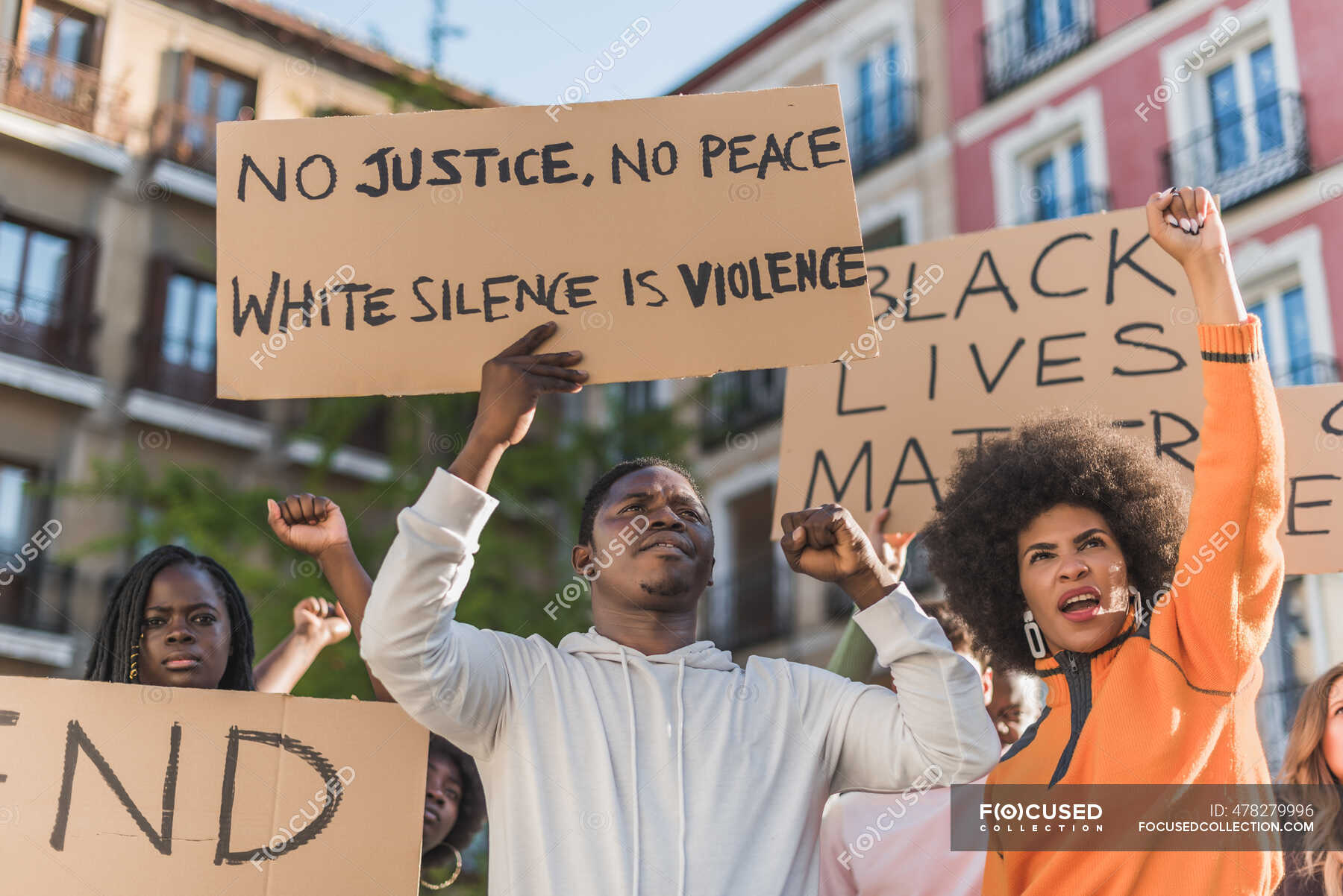 Crowd of multiracial people with Black Lives Matter poster protesting ...