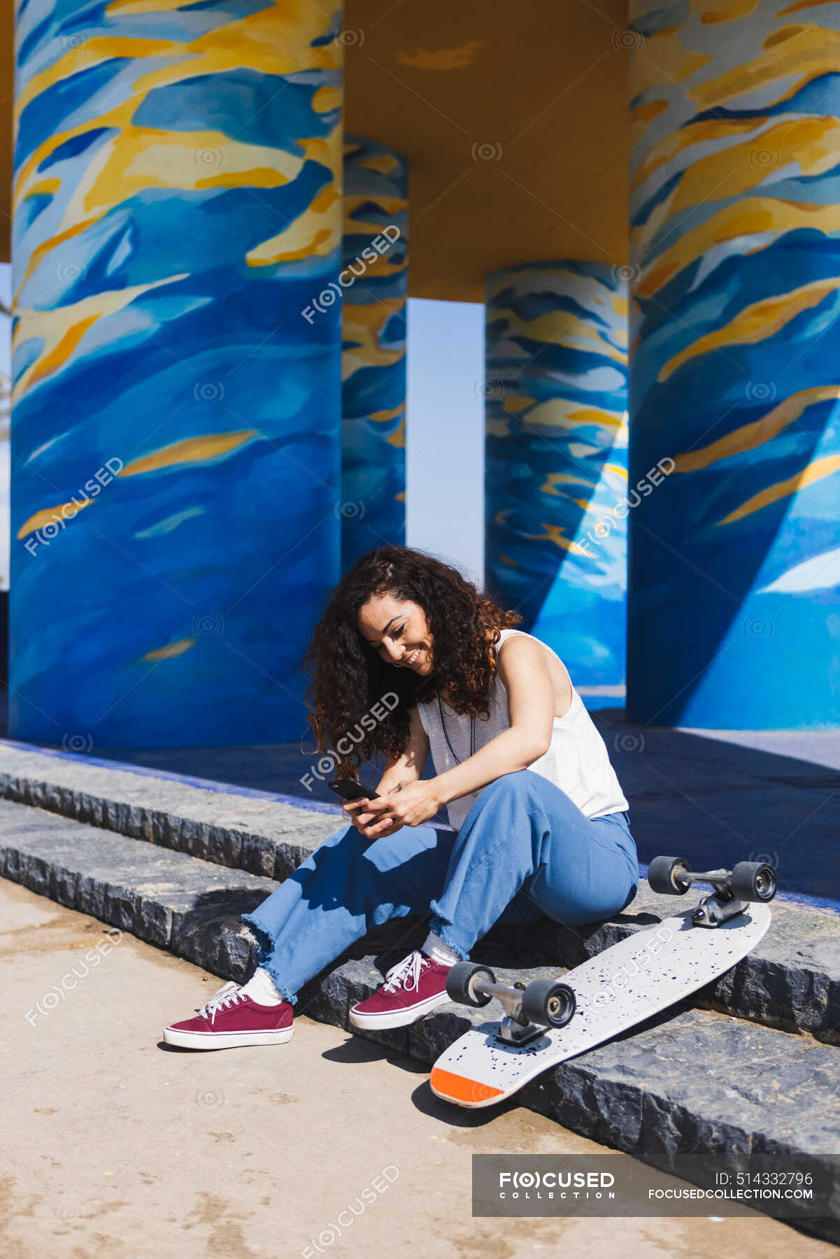 full-body-side-view-of-female-in-casual-clothes-sitting-on-stairs-near