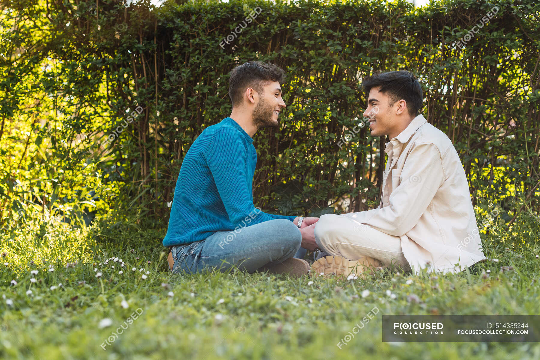 Side View Of Delighted Homosexual Couple Of Men Looking At Each Other In Park — Lover Male