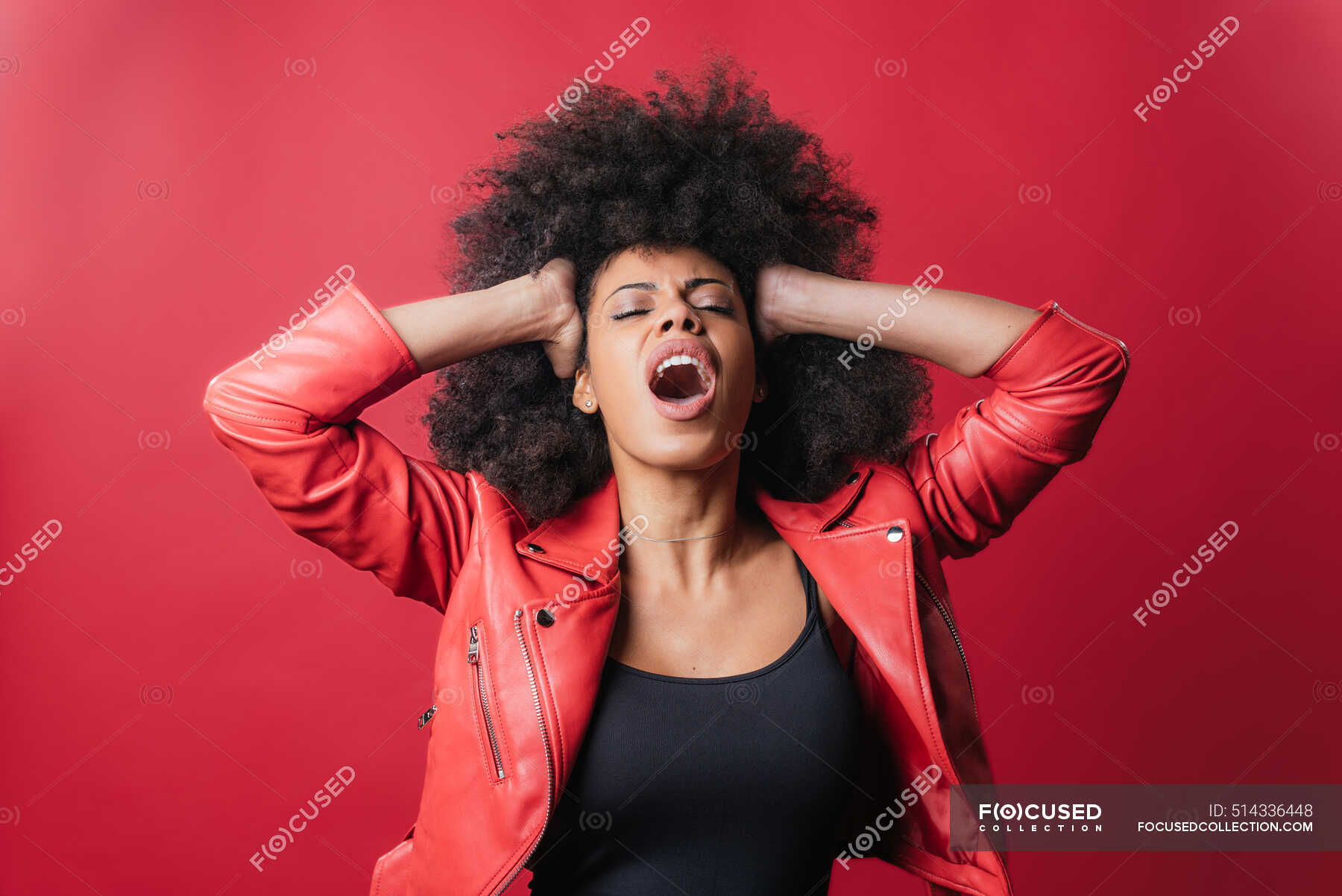 Naughty African American Female Screaming And Touching Hair On Red