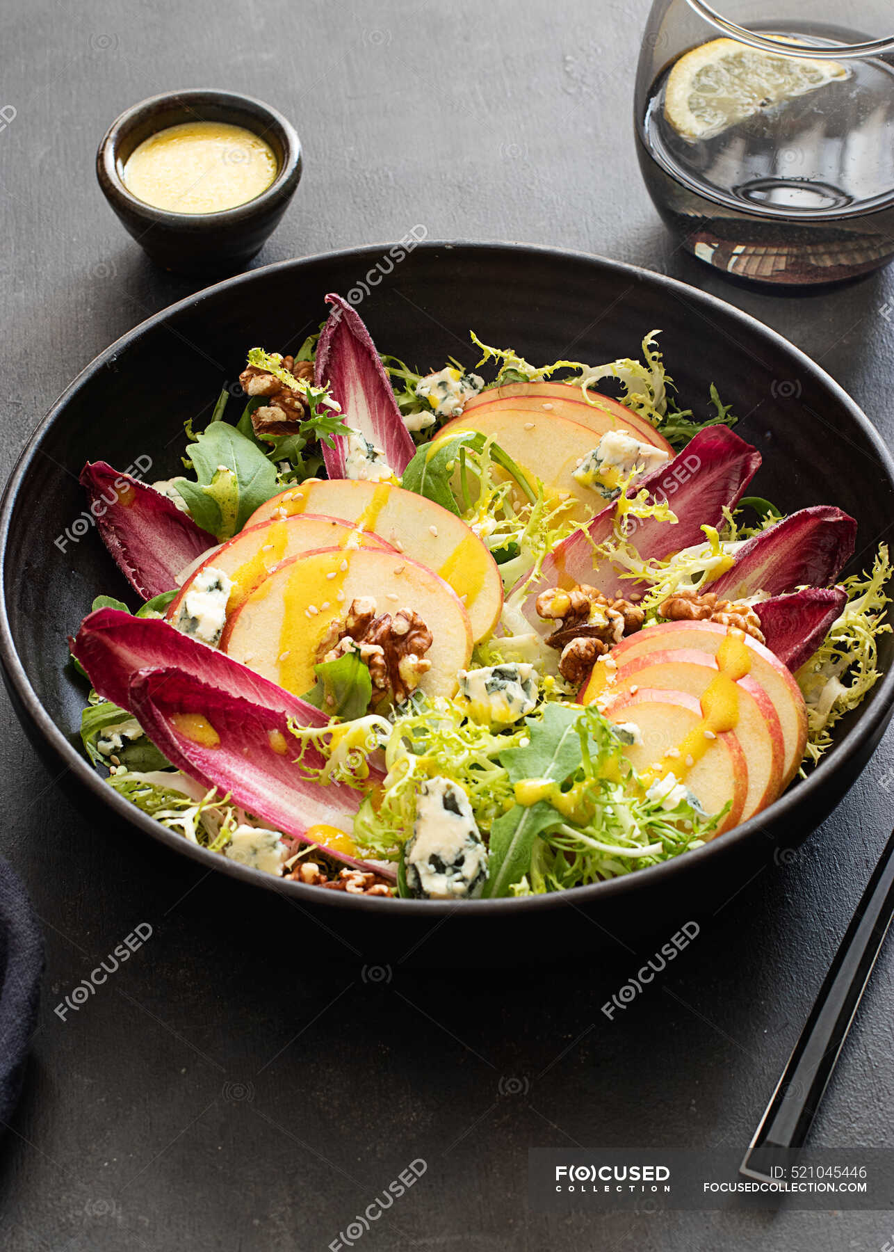 From above colorful delicious salad with endives, apple and roquefort