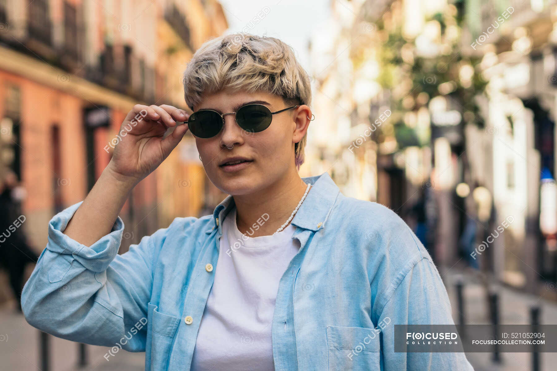 Stylish Teenager Girl With Short Hair Putting On The Sunglasses stylish-teenager-girl-with-short-hair-putting-on-the-sunglasses