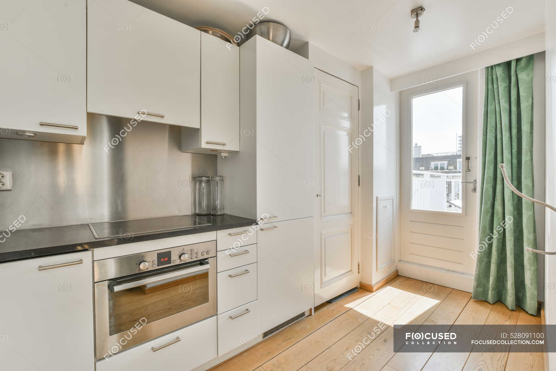 focused_528091100-stock-photo-modern-kitchen-interior-refrigerator-stove.jpg