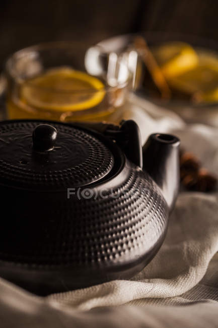 Stylish teapot and cup of tea — Stock Photo