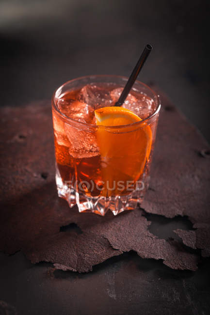 Glass of vermouth with ice and orange — Stock Photo