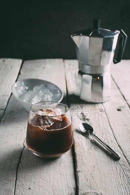 Coffee with ice on table — Stock Photo